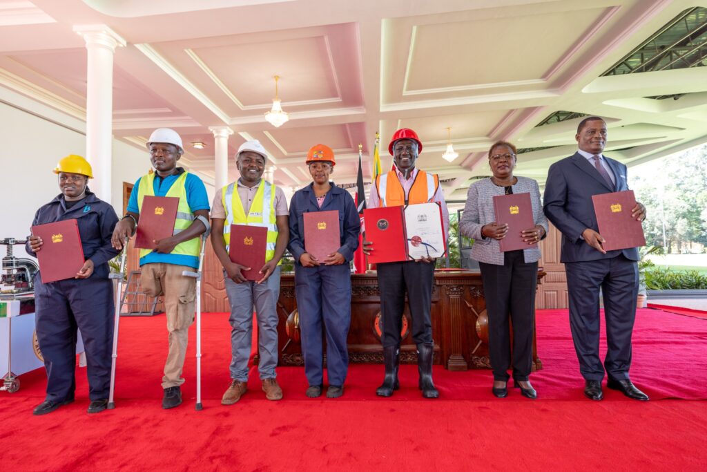 President William Ruto poses for a photo after assenting to the Affordable Housing Act at State House Nairobi on March 19, 2024.
