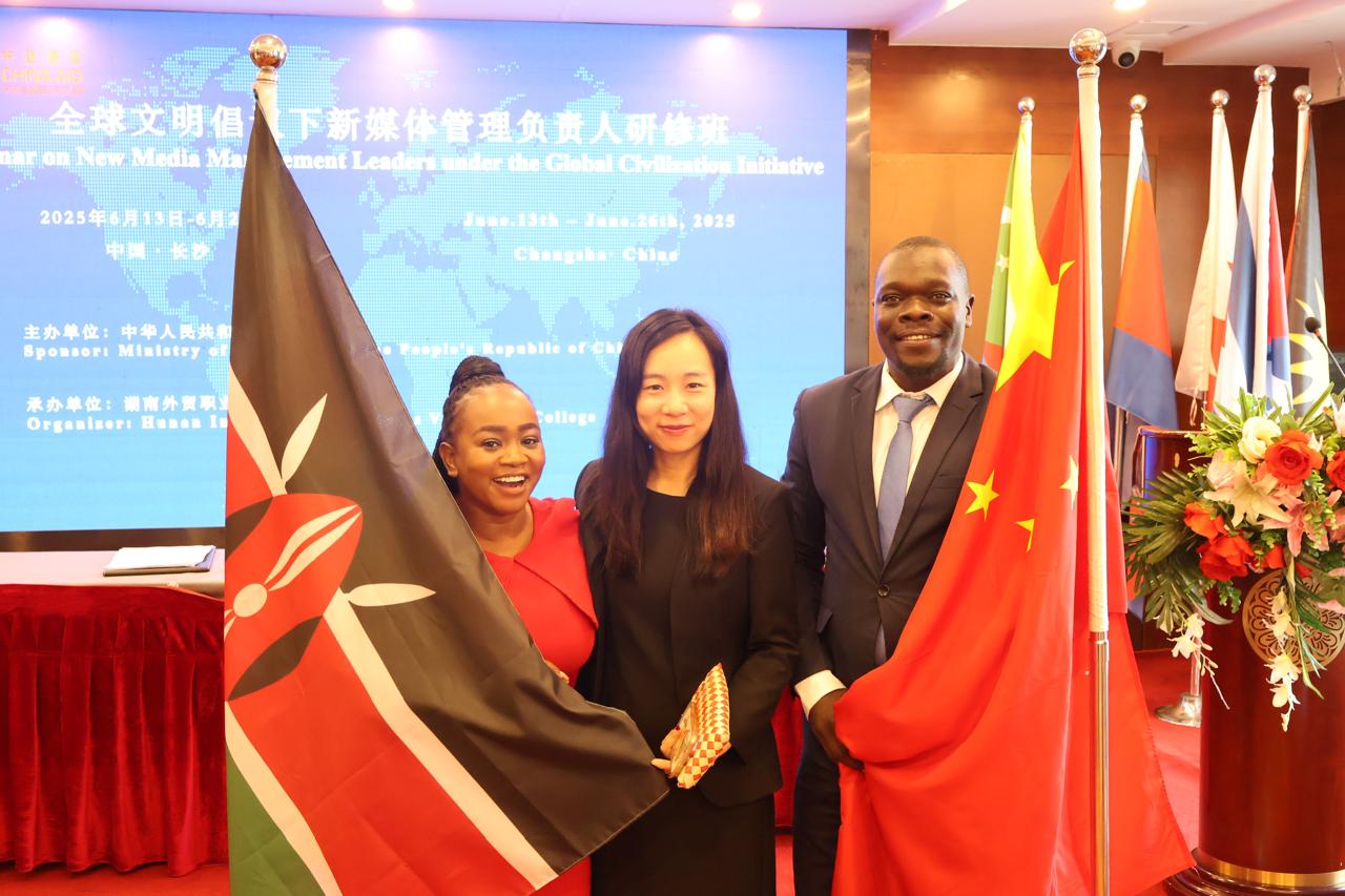 TV47’s Elizabeth Mutuku (left) after receiving the award on New Media Management in China.