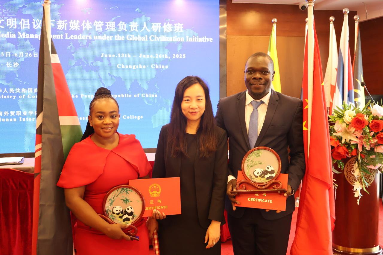 TV47’s Elizabeth Mutuku (left) after receiving the award on New Media Management in China.