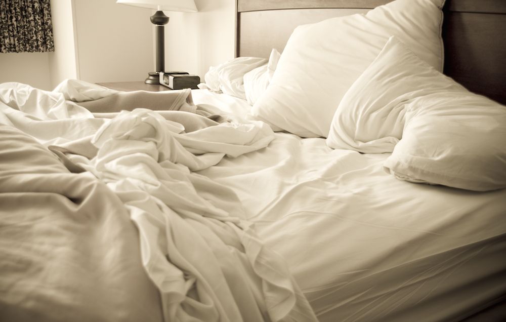 How often should you really be washing your bedding? A microbiologist explains