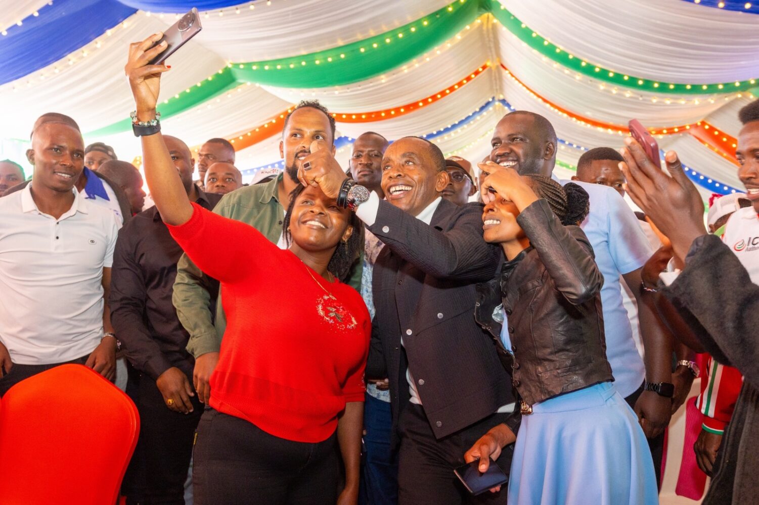 Governor Kimani Wamatangi takes a selfie with some of the 4500 youth attending the Kiambu Youth Day at the County HQ on Friday August 29, 2025.