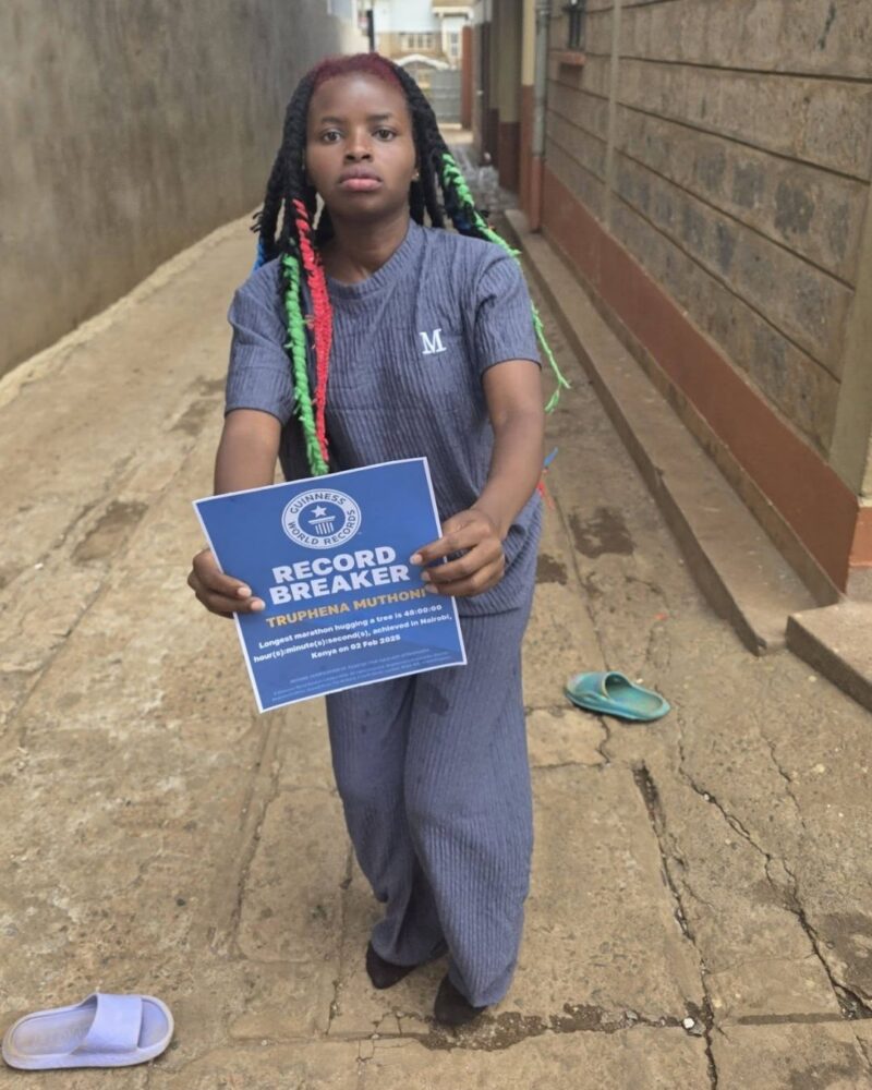 Truphena Muthoni receives her record badge from Guiness World Records