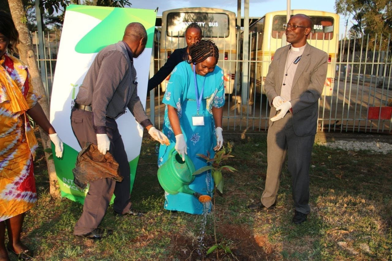 Ms Prisca Kamungi, the National Peace and Development Officer at the United Nations Resident Coordinator Office planting the peace tree.