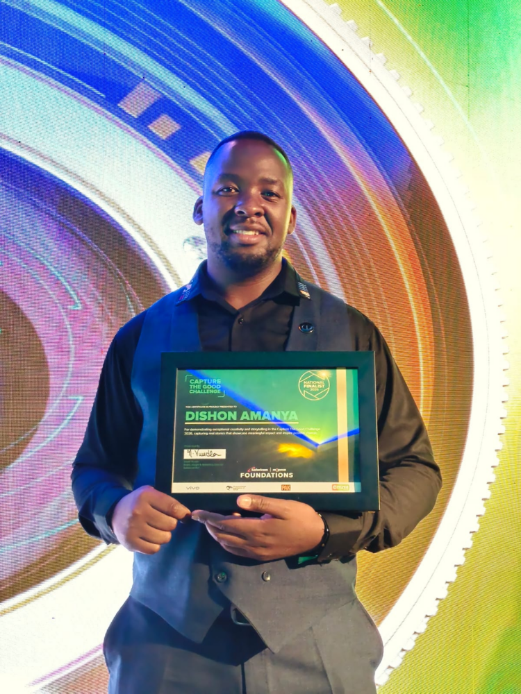 Dishon Amanya with a finalist certificate at the capture the good gala awards in Nairobi